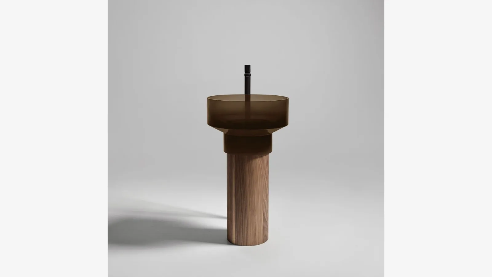 Borghi pedestal sink by Antoniolupi in glass and wood.