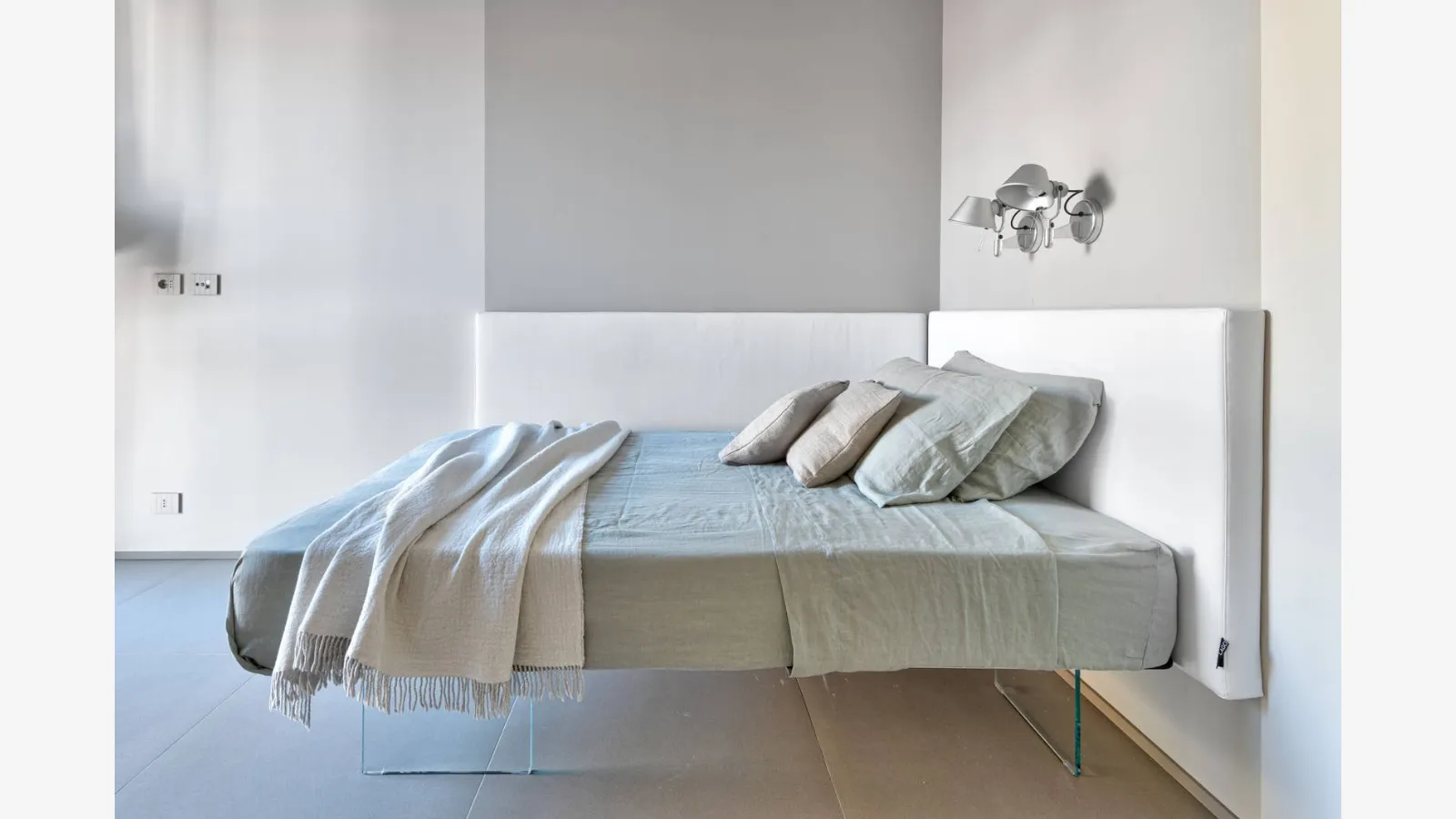 Bed Air 1507 with padded fabric headboard by Lago.