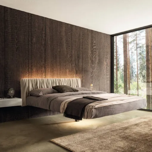 Suspended bed Fluttua 1631 with pleated leather headboard by Lago.