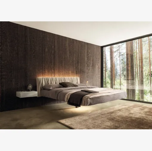 Suspended bed Fluttua 1631 with pleated leather headboard by Lago.