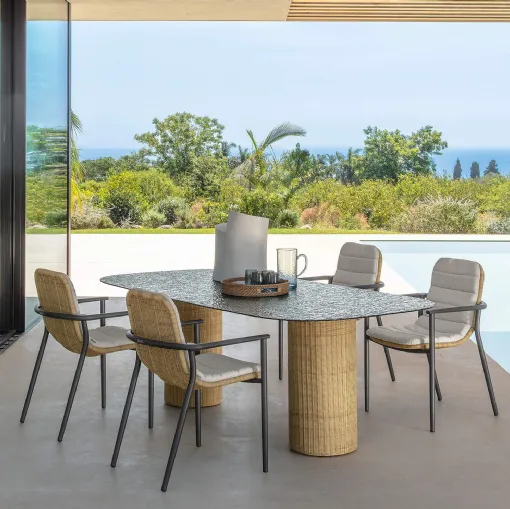 Glass table and Bond rattan chairs by Talenti.