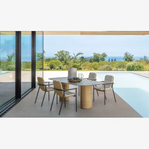 Glass table and Bond rattan chairs by Talenti.