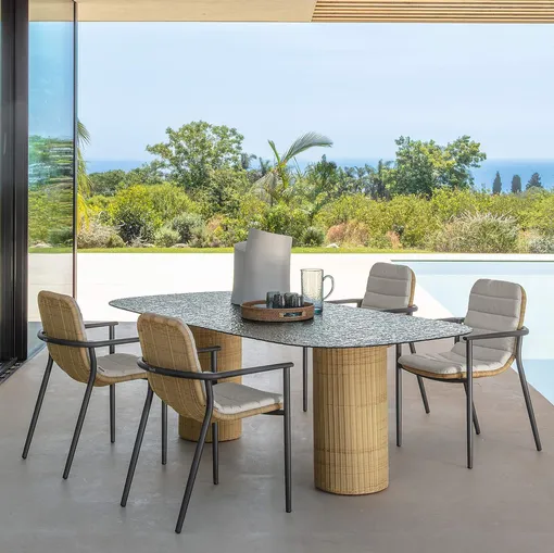 Glass table and Bond rattan chairs by Talenti.